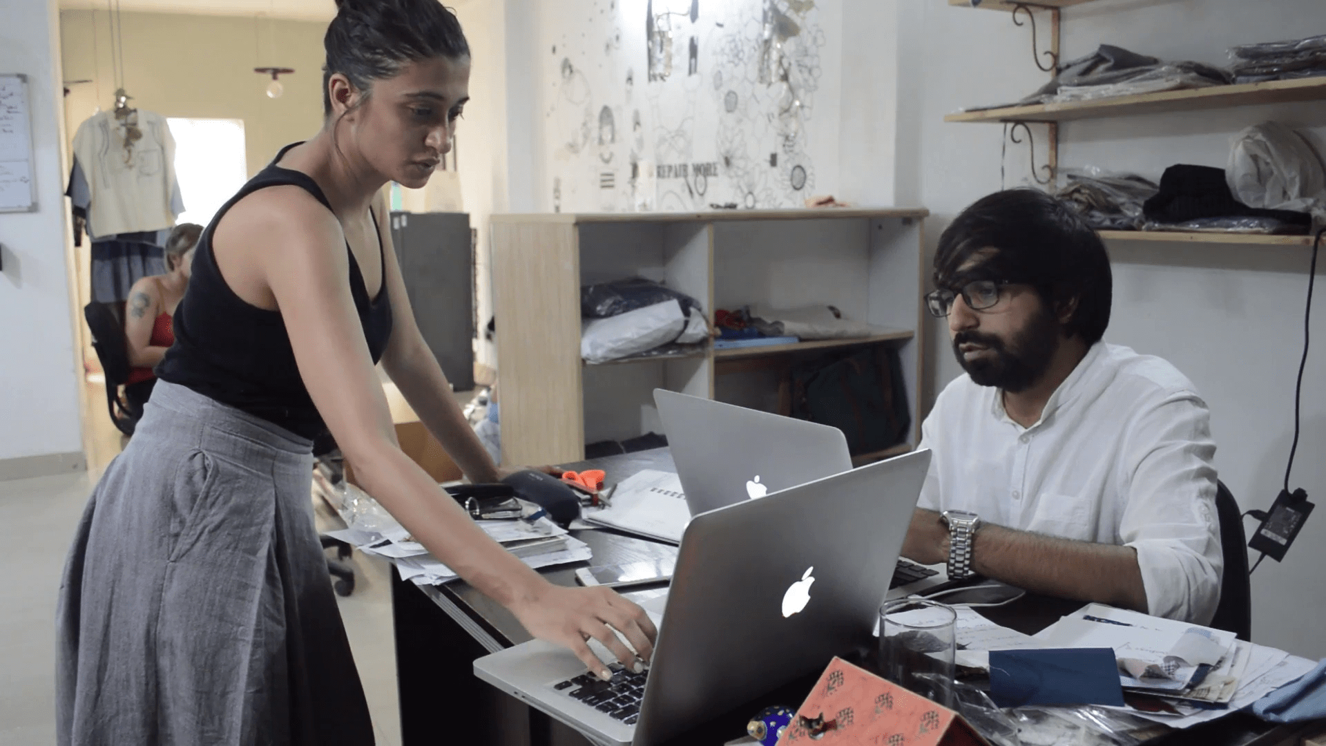 kriti tula having discussion with a co worker